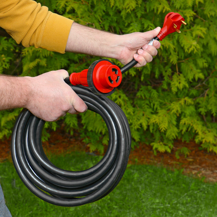 Valterra 30 Amp RV Detachable Power Cord A10-3025ED Held Coiled Outdoors Showing Both Ends - Lifestyle View | United RV Parts