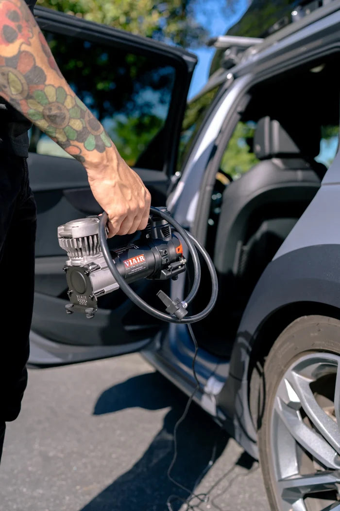 Viair Portable Air Compressor Being Used for Vehicle Tire Inflation | United RV Parts