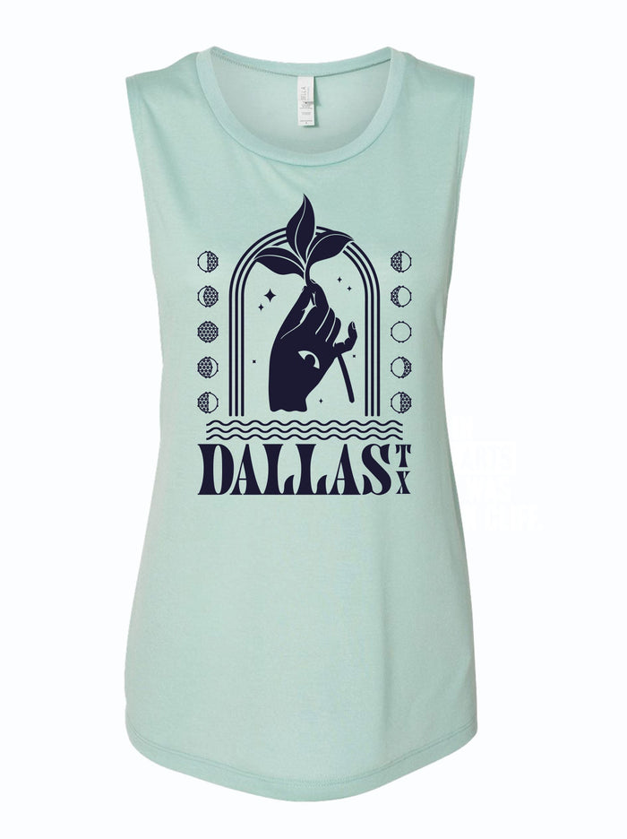 Women's Mystic Dallas Muscle Tank in mint color featuring a stylish design with the word 'DALLAS' and a plant graphic. Perfect as a Texas themed gift, this tank top embodies the spirit of Texas with its relaxed fit and is an ideal souvenir from Texas, making it a great addition to any Texan gifts collection.